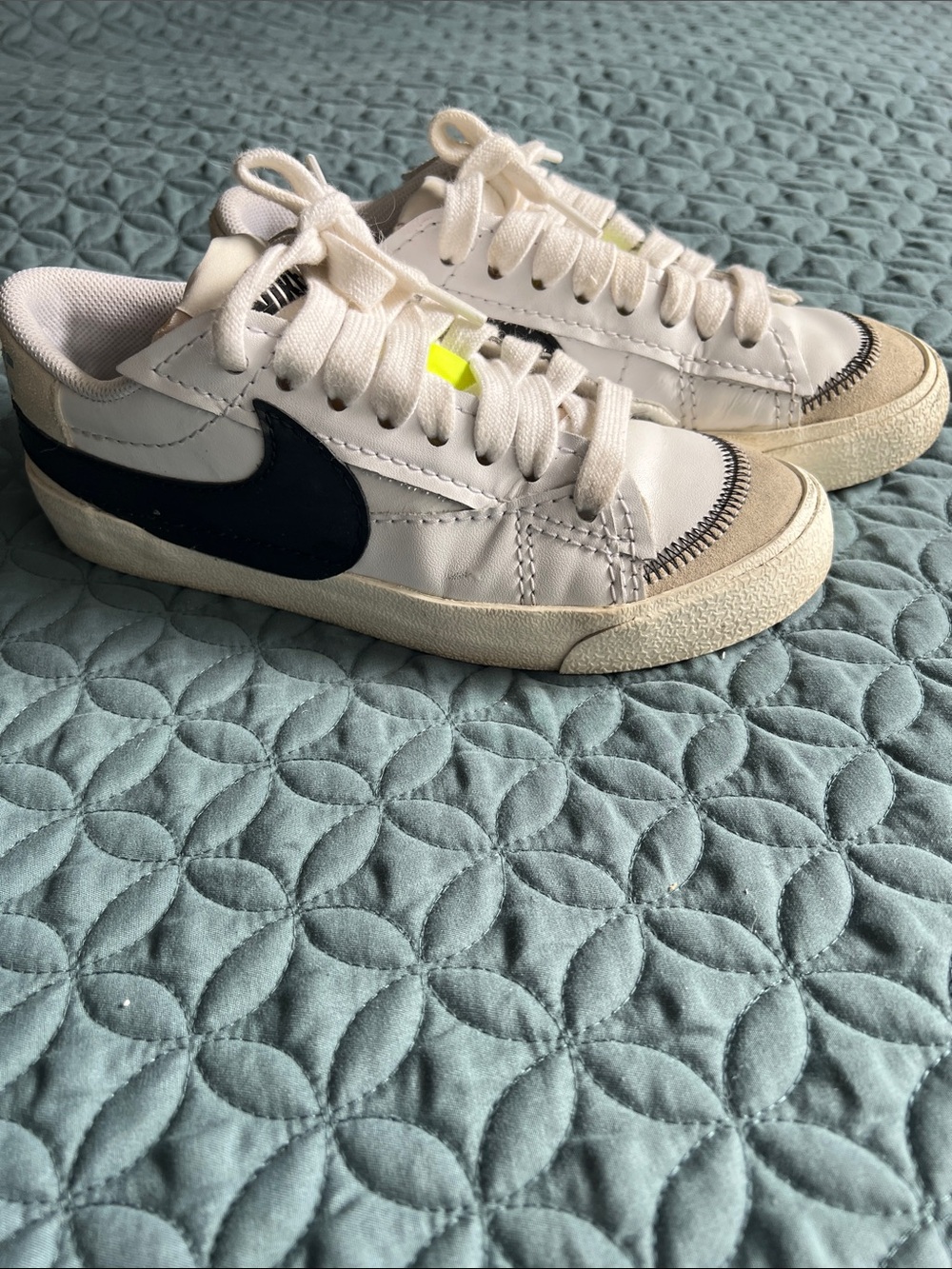Nike White Low-Top Sneakers with Black Swoosh and Neon Yellow Tab